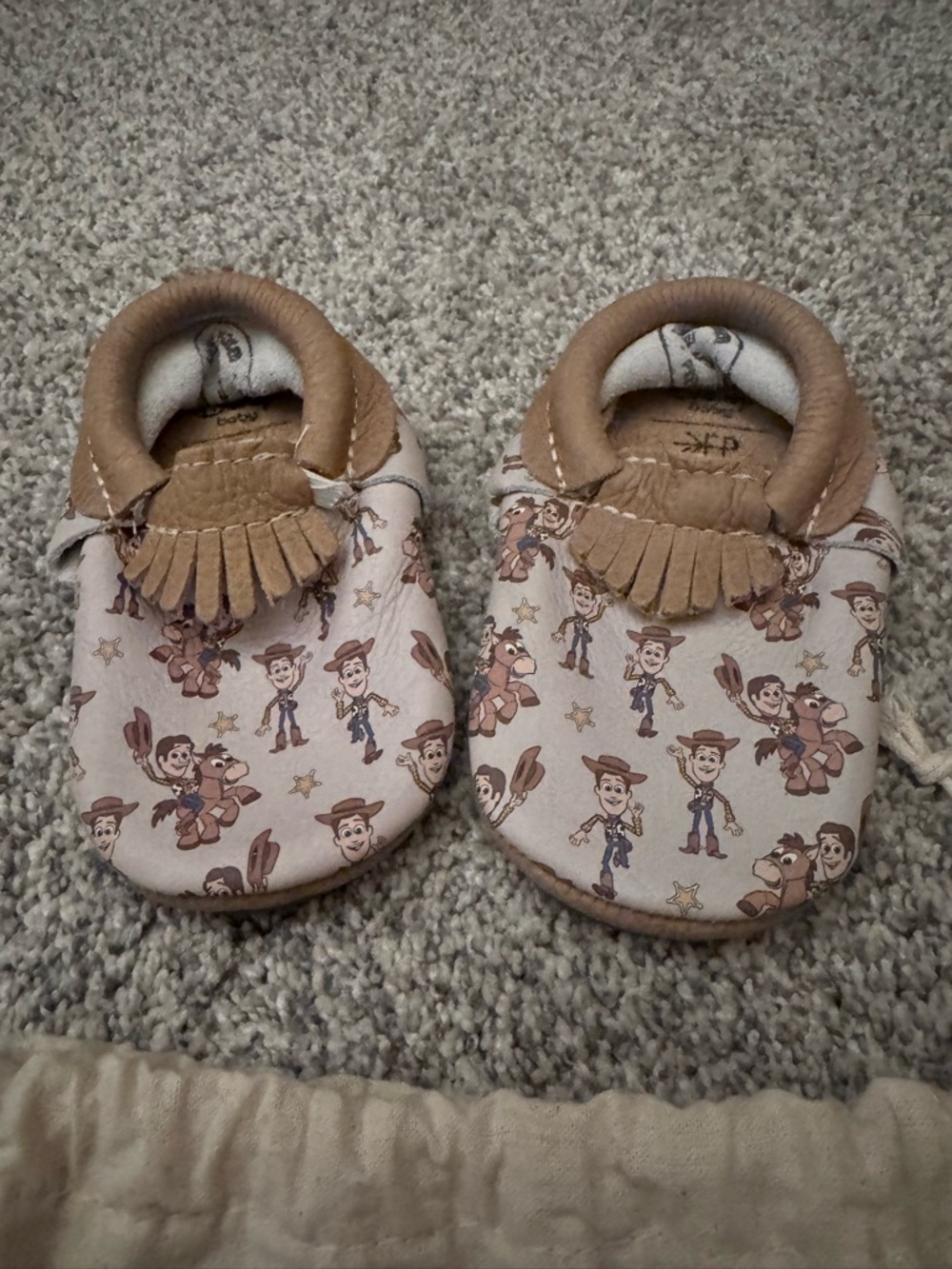 Toddler Moccasin Shoes in Tan and Cream in Toy Story print - woody and bullseye